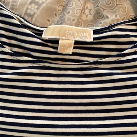 michael kors blue and white striped shirt|Michael Kors black sweatshirt.